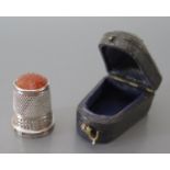 An Edward VII Silver Thimble with agate top Chester 1907, Charles Horner and leather case