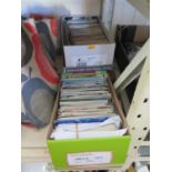 Three boxes of modern postcards