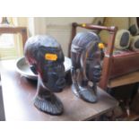 Circular mirror, carved African busts and pewter dish