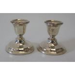 A pair of modern loaded silver candlesticks