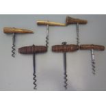 A 19th Century corkscrew with turned wooden handle and others with antler handles