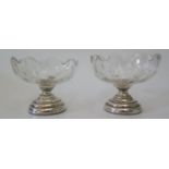 A pair of loaded silver based sundae dishes