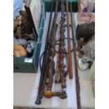 A silver mounted ebony cane, and other Canes and sticks