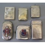 A collection of silver plated and other vestas