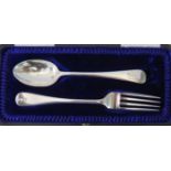 A cased matched silver christening spoon and fork