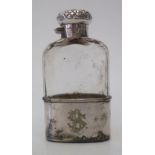 A silver top slice cut glass hip flask