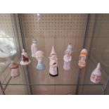 A collection of Royal Worcester and other candle extinguishers