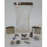A silver coloured cut glass vase, pair of napkin Rings, thimble etc