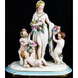 A 19th Century Royal Worcester figural group depicting ladies with fruit and putti, 29 cm