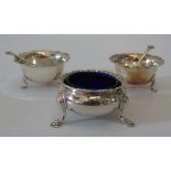 A pair of Edward VII silver salts with spoons and one other