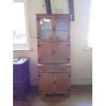 An Old Pine Freestanding Kitchen Unit with sunburst leaded and glazed cupboard to the top