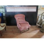 A Victorian Button Back Armchair