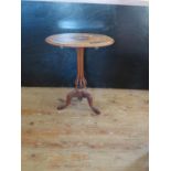 An Unusual 19th Century Italian Occasional Table with marquetry inlaid top and resting on an eight