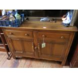 An Ercol Mid Elm Low Sideboard