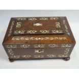 A Nineteenth Century Rosewood and Ivory Inlaid Workbox with fitted interior and four mother of