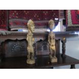 A Pair of Ivory Coast Carved Wooden Figurines