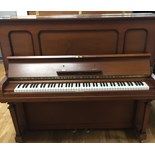 Steinway (c1927) A Model K upright piano in a mahogany case.