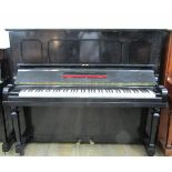 Steinway (c1925) A Model K upright piano in an ebonised case.