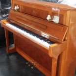 Schimmel (c1987) A Model 121 upright piano in an antique style walnut case.