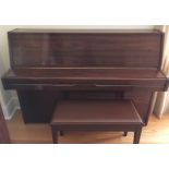 Yamaha (c1985) A Model M1J upright piano in a satin walnut case; together with a stool.