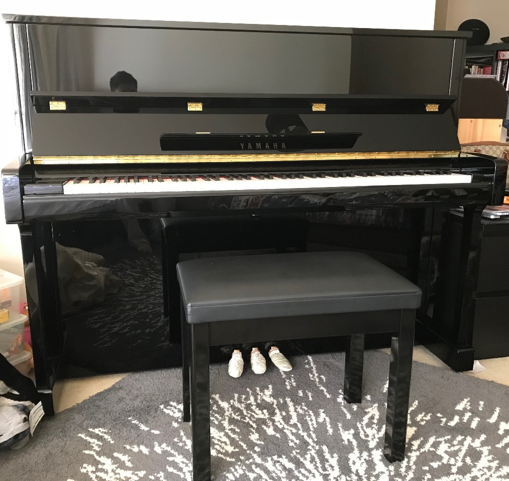 Yamaha (c2016) A Model B3E upright piano in a bright ebonised case;