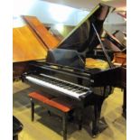 Kawai (c1972) A 5ft 10in Model KG-2 grand piano in a bright ebonised case on square tapered legs.