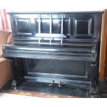 Steinway (c1892) An upright piano in an ebonised case.