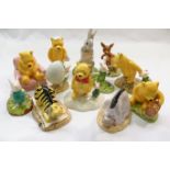 A collection of 12 Royal Doulton Winnie the Pooh figures, comprised of 'Piglet and Honey Pot',