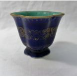 A Chinese powder blue gilt decorated quatrelobed footed cup,