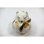 A Royal Crown Derby bone china paperweight of a doormouse, with gold stopper,