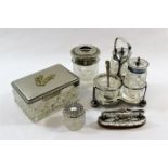 A small silver topped cut glass dressing table jar, Birmingham 1901, a silver mounted nail buffer,