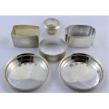 A collection of small silver items comprised of a pair of circular coasters,