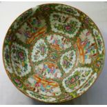 A large Chinese famille rose punch bowl, decorated with figural and floral panels,