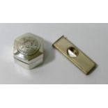 A silver cigar cutter,