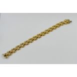 A 9 carat gold Italian hollow link bracelet, 1.1cm wide, with import marks for Sheffield 1994, 12.