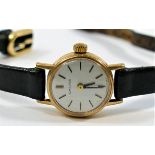 A ladies Longines 9 carat gold cased wrist watch, the round face with baton numerals, London 1973,