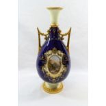 A Coalport two handled porcelain vase, with cobalt blue and cream body,