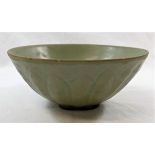 A Chinese celadon Song/Yang dynasty footed bowl, probably retrieved from a ship wreck,