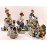 Five Lladro figural groups with dogs and puppies, the tallest 19.