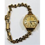 A ladies nine carat gold cased Omega wrist watch, with 15 jewel movement,