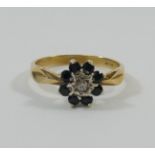 A 9 carat gold sapphire and diamond flower head cluster ring, London 1978,