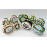 A collection of nine Halcyon Days enamel boxes, a ceramic book ornament entitled 'LOVE', 9cm high,
