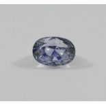 An unset oval pale mixed cut sapphire, the loose stone measuring approximately 10mm long,