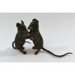 A cold painted bronze group of mice reared up, 5.