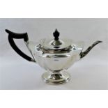 A silver pedestal teapot, Sheffield 1913 by Mappin and Webb, with ebonised handle and knop,