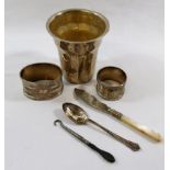 A small quantity of silver items comprised of an oval napkin ring and a small circular napkin ring,