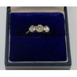 A diamond three stone ring, the old round brilliant cut stones approximately 0.29, 0.70 and 0.