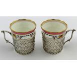 A pair of Aynsley porcelain coffee cans, with printed decoration and gilt detail,