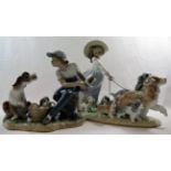 Two Lladro porcelain groups of figures with dogs and puppies, the tallest 24.