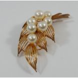 A yellow metal cultured pearl foliate brooch, stamped 'K14', 5.9cm long, 10.